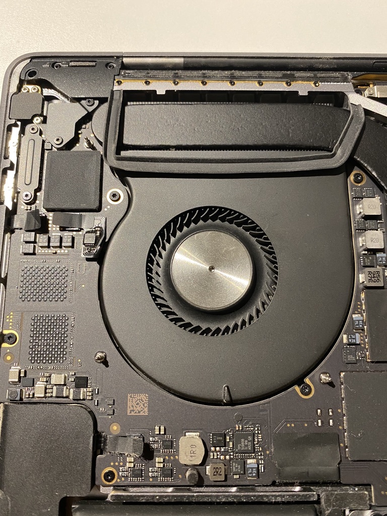 left mackbook pro fan completely clean with the air dividers visible